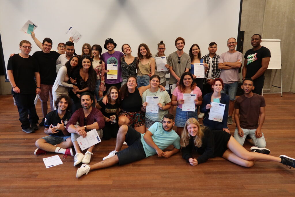 A group of youth leaders celebrating their achievements of learning about Eu values, the human rights education through music.