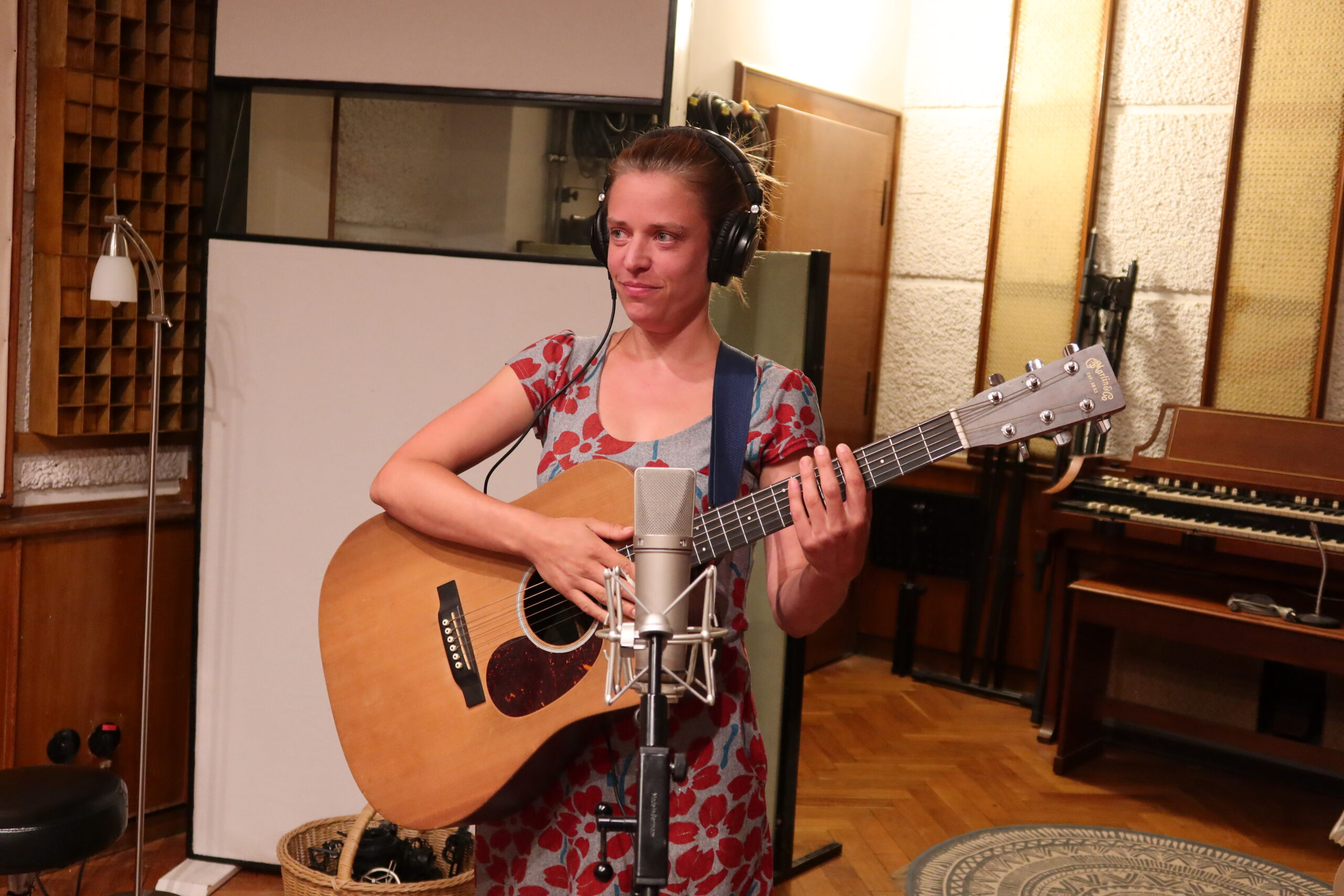 A musician with a guitar singing about Eu Values at a Songs For Change workshop