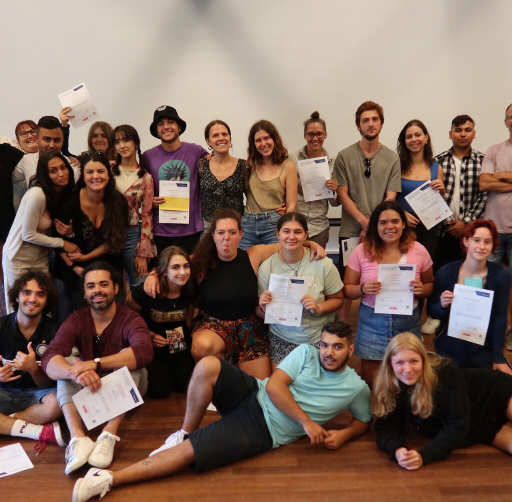 A group of youth leaders celebrating their achievements of learning about Eu values, the human rights education through music at a partner meeting.